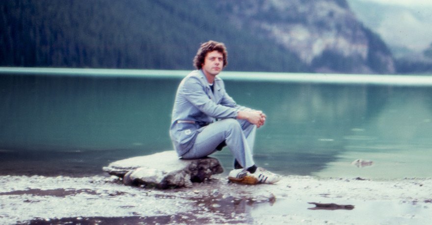 Allister MacGillivray sitting along the water